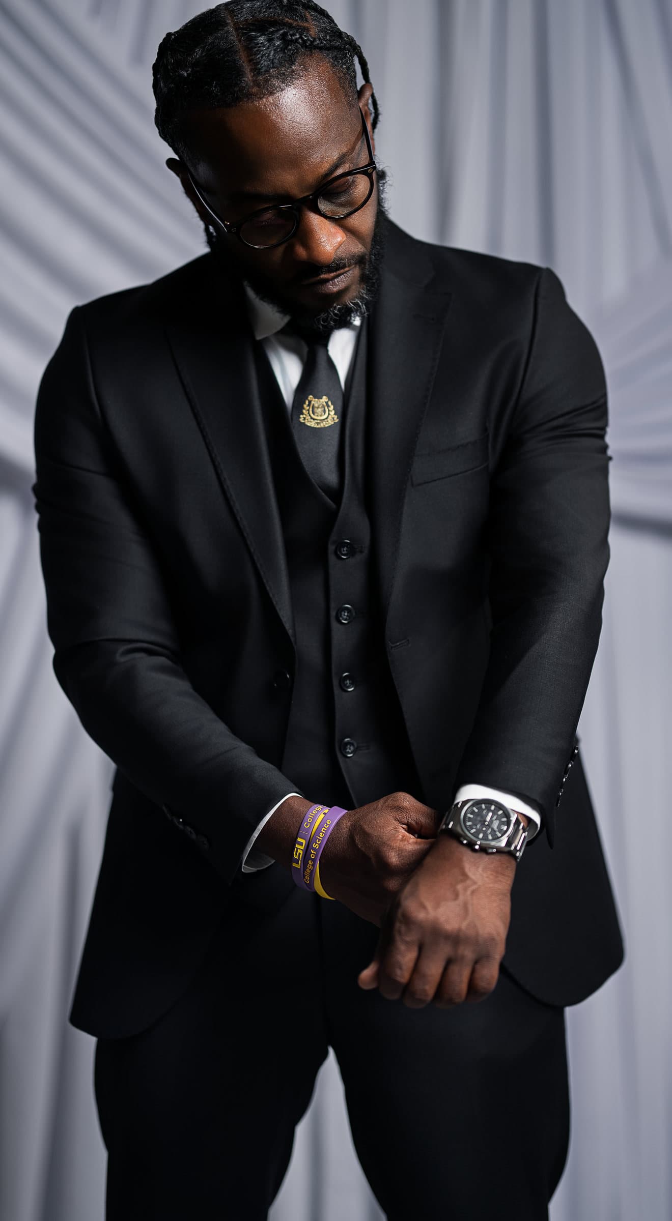 Jerry, full length in a black three-piece suit