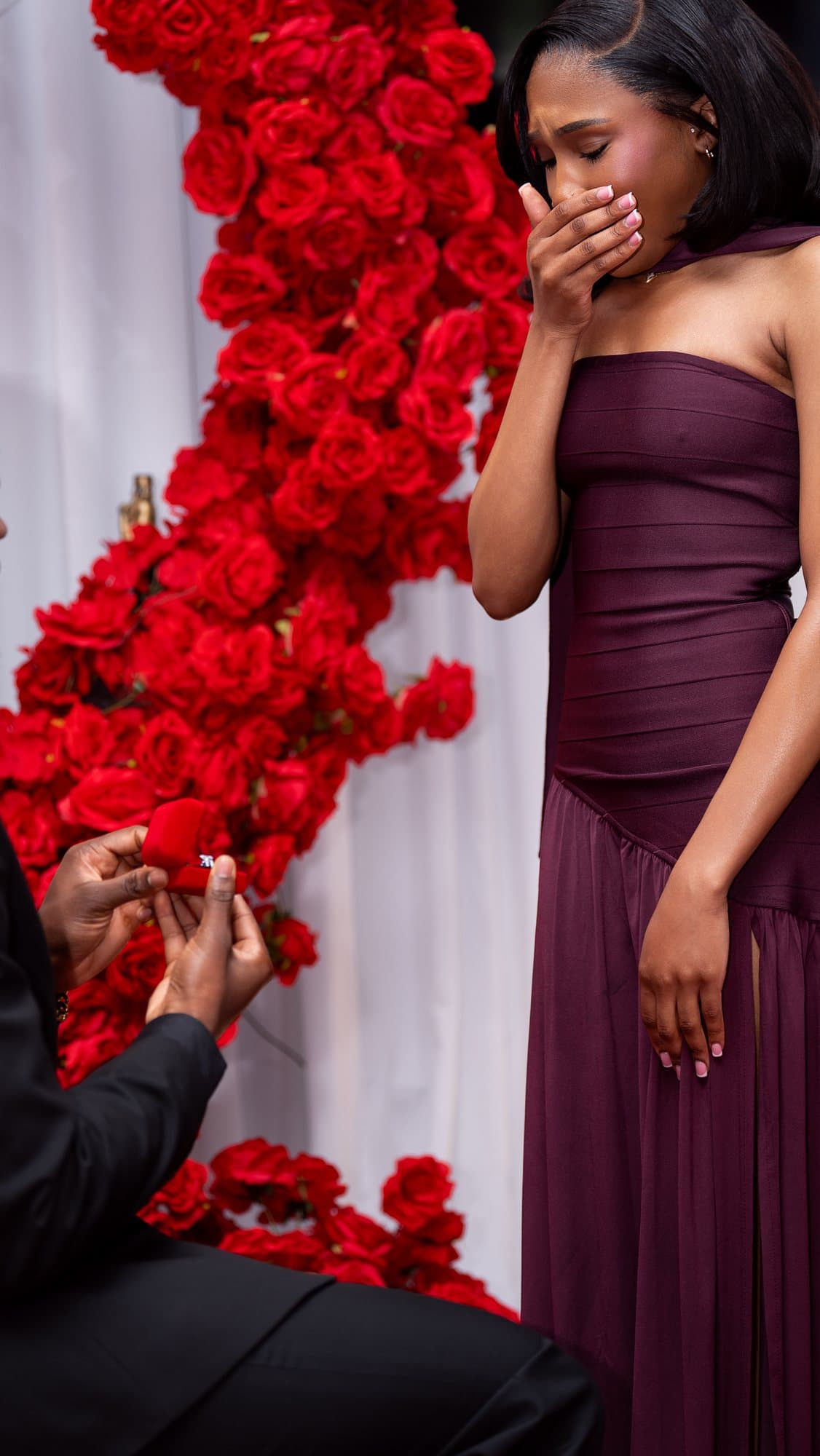 Her answer, a hand to her face