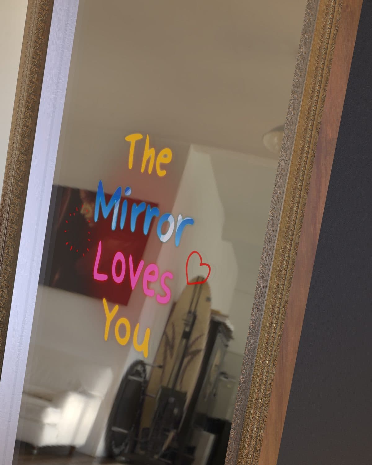 Close view of the mirror's animated greeting inside its ornate gold frame